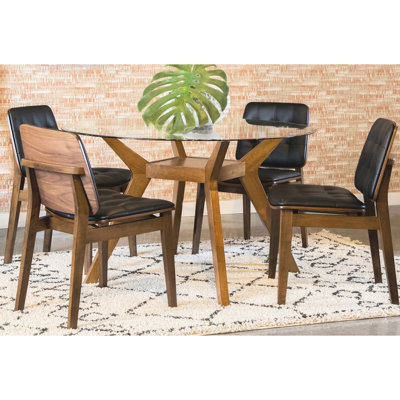 Table ronde en verre 5 pièces, style Mid-Century, finition brune, chaises d'appoint rembourrées noires pour quatre personnes dans une pièce de décoration intérieure, finition bois, personnes