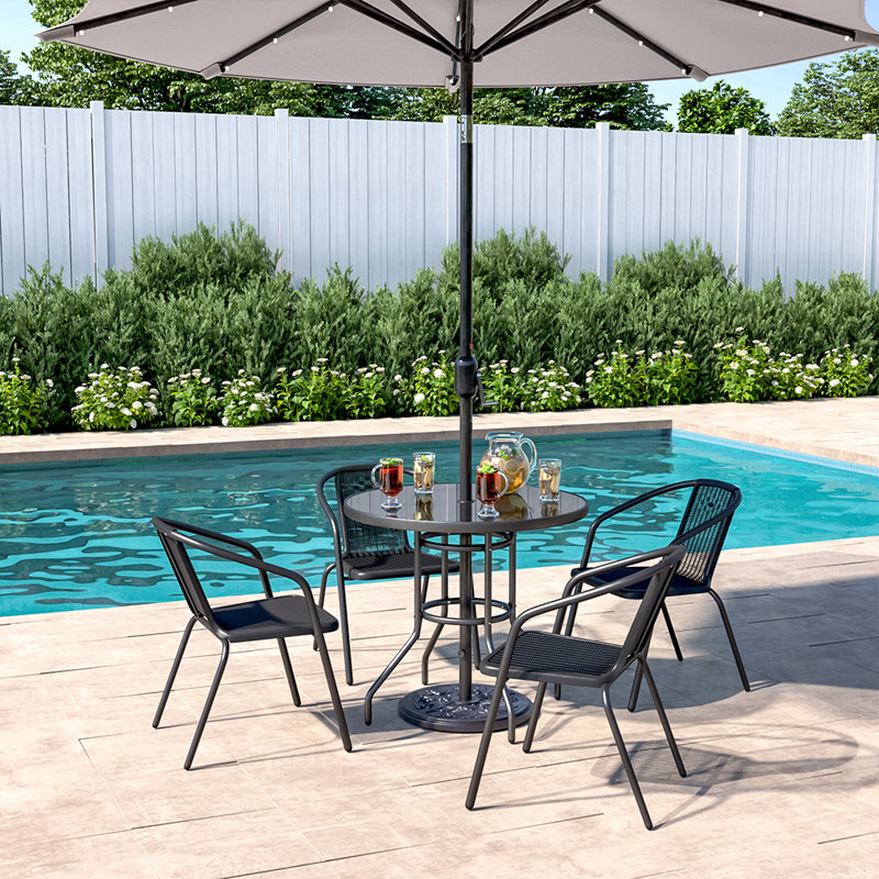 Mclin 4 - Person Patio Dining Set with Round Table , Cushions Included