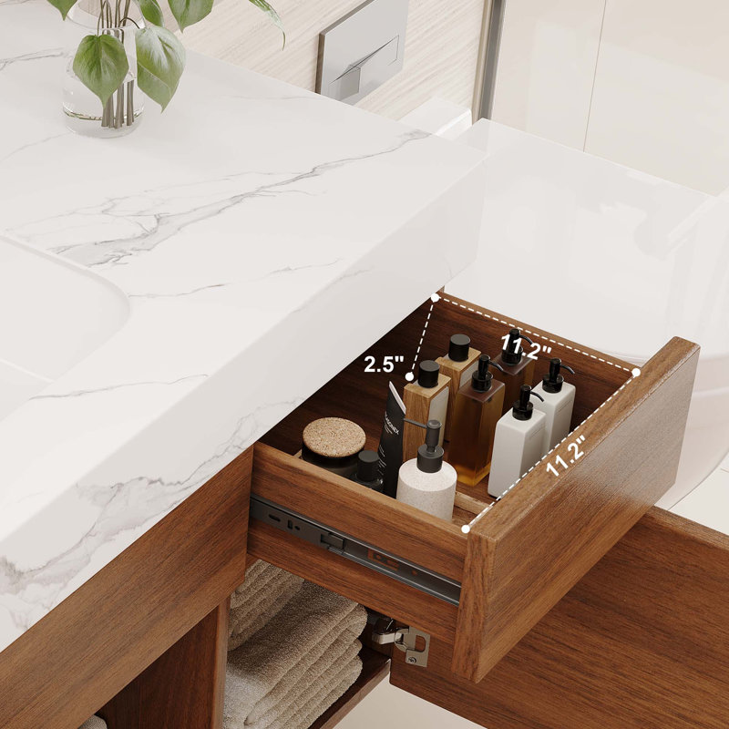 Meuble-lavabo suspendu moderne avec comptoir en pierre frittée sans joint.