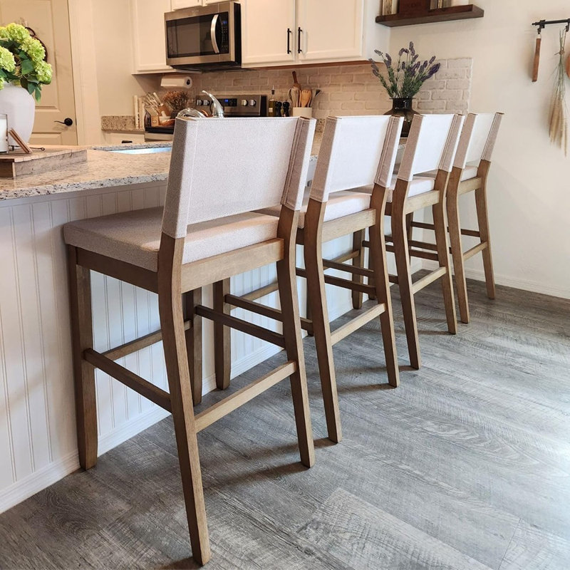 Tabouret de bar moderne rembourré avec dossier et pieds en bois d'hévéa massif, finition brun clair brossé