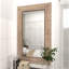 Miroir mural floral en bois brun avec des sculptures crème détaillées