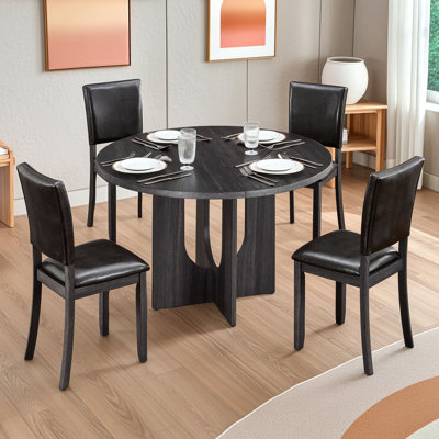 Ensemble de salle à manger rond cinq pièces avec quatre chaises rembourrées