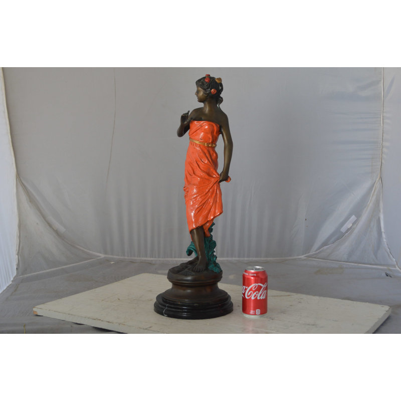 Young Lady In Orange Bronze Statue - Size: 7"L X 26"W X 25"H.