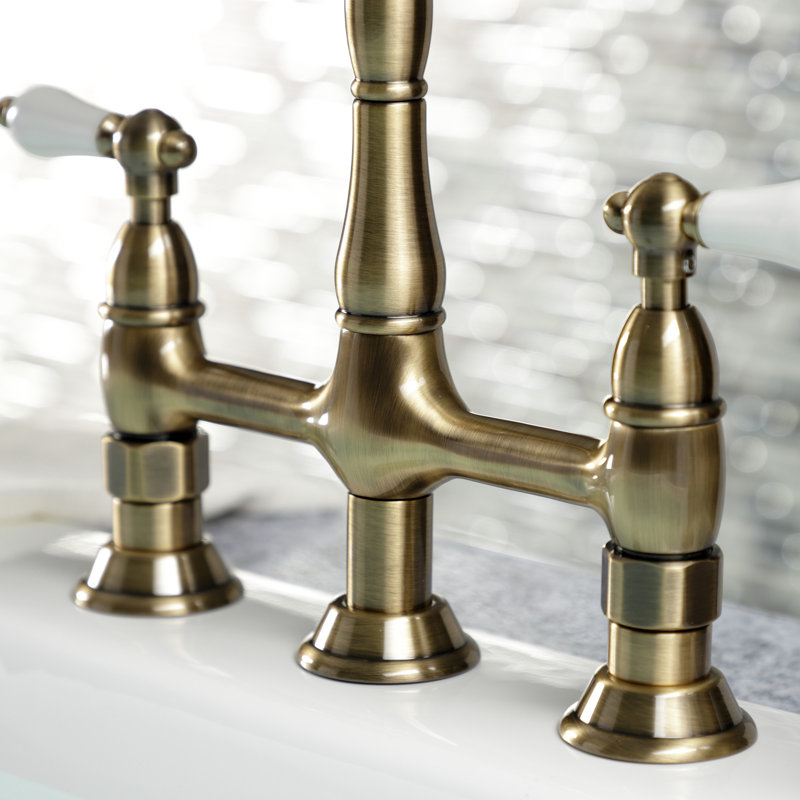 Kingston Brass Heritage Two-Handle 4-Hole Deck Mount Bridge Kitchen Faucet with Brass Side Sprayer, Vintage Brass