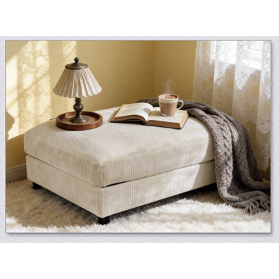 Repose-pieds rembourré en velours côtelé avec rangement caché, parfait pour les espaces de vie modernes et fonctionnels.