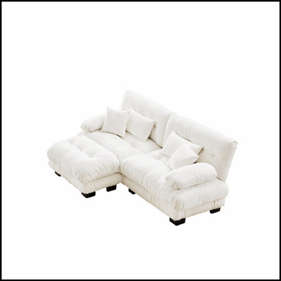 Luxueux canapé en chenille pour le salon avec plusieurs coussins et repose-pieds