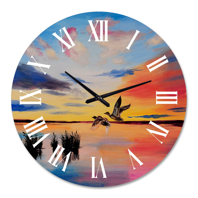 Grues volant pendant un coucher de soleil coloré - horloge murale nautique et côtière, Moyenne
