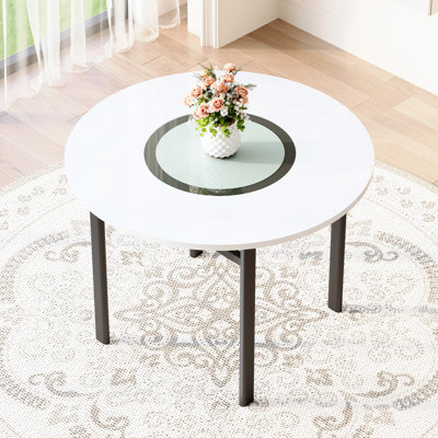 Table de salle à manger ronde blanche de 107 cm (42 pouces), de style minimaliste moderne, avec dessus en verre gris et support en métal noir. Structure stable et polyvalente, idéale pour les réceptions.