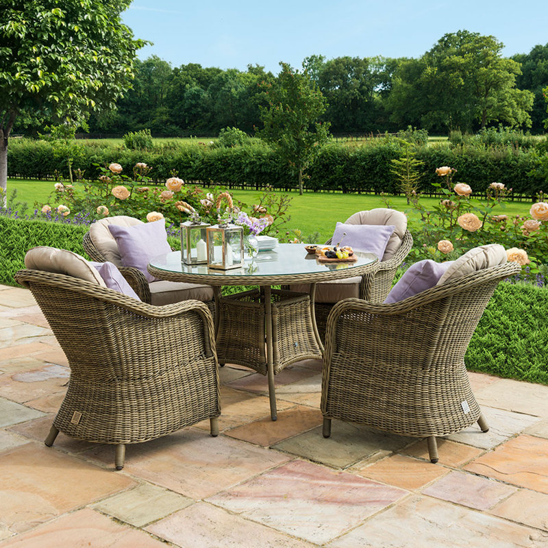 Danterius 4 - Person Patio Dining Set Round Table with Cushions Included