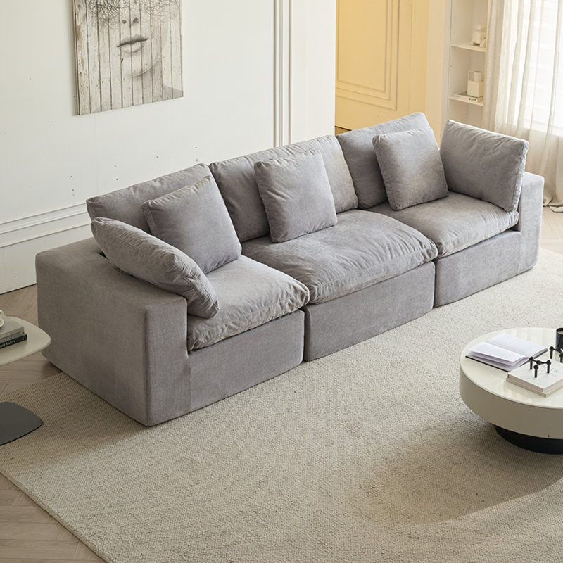 Canapé en tissu compressé peu encombrant avec un design moderne minimaliste pour un salon confortable