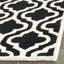 Tapis géométrique en laine noir-796913307