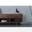 Cabinet audiovisuel noir avec tiroir en noyer