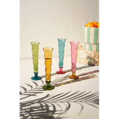 SET OF FOUR GLASS TRUMPET VESSELS - ONE EACH COLOR