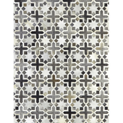 Ivoire en cuir de vache fabriqué à la main à motif géométrique Florentina/Tapis décoratif grise