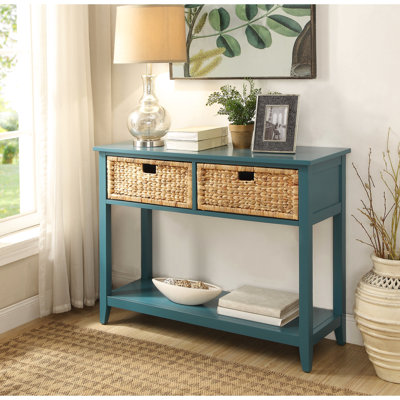 Console rectangulaire bleu sarcelle avec 2 tiroirs et une tablette pour placer les articles de finition du bas