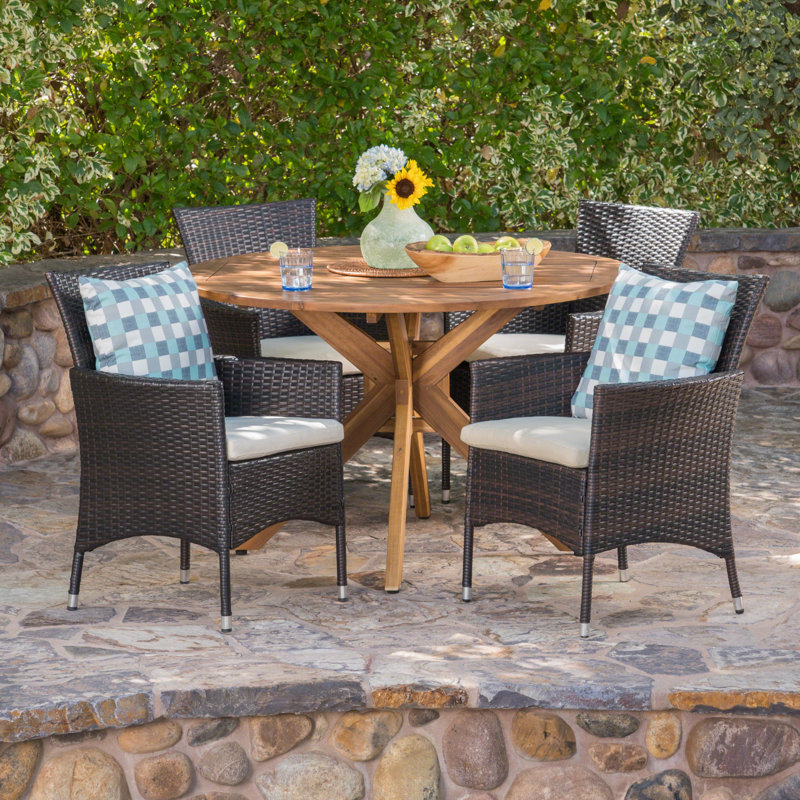 Stennis 4 - Person Acacia Wicker Patio Dining Set with Round Table , Cushions Included, Light Brown