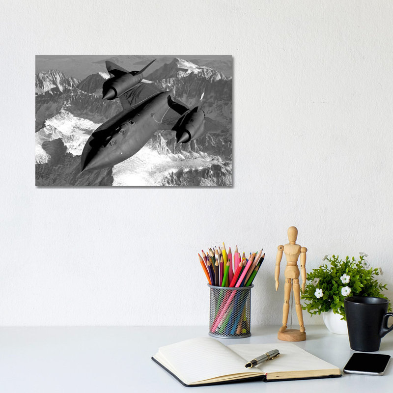 A SR-71B Blackbird Flying Across The Sierra Nevada Mountains by Stocktrek Images - Wrapped Canvas Print