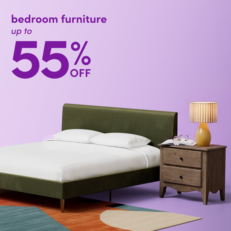 Bedroom furniture up to 55% off featuring a green upholstered bed frame, a wooden nightstand, and a lamp on a purple background.
