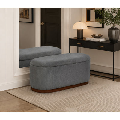 Grey corduroy lift-top storage bench featuring high-resilience foam cushioning and a spacious flip-top storage compartment—a versatile seating solution for bedrooms and entryways.