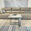 Table basse de salon rectangulaire avec plateau en pierre frittée et structure en métal argenté, résistante aux égratignures et facile à nettoyer