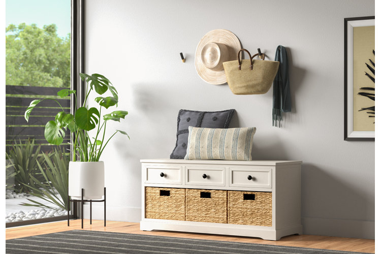 modern entryway with a wood storage bench and wicker baskets