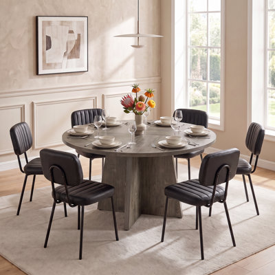 Ensemble de table de salle à manger à piédestal rond avec chaises capitonnées en similicuir
