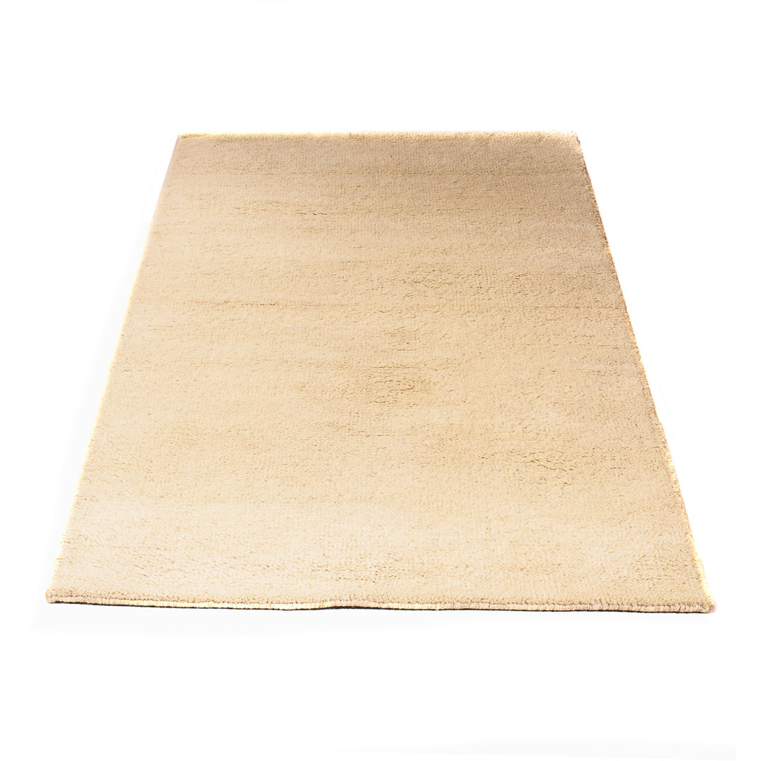 Handgefertigter Teppich Jamyiah aus Wolle in Beige