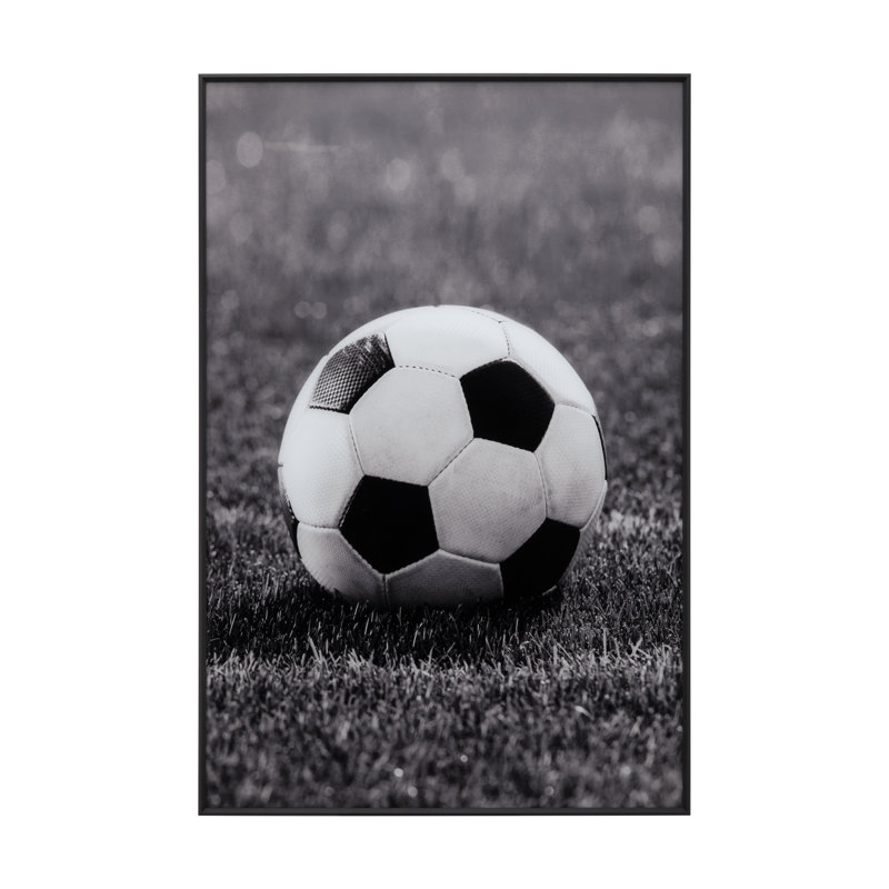 Tableau encadré représentant un ballon de soccer en pleine action