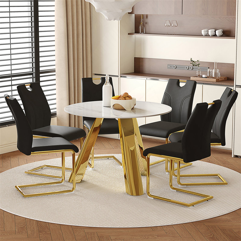 Ensemble de table de salle à manger moderne en pierre frittée de 42 pouces avec quatre chaises en polyuréthane pour les espaces de vie contemporains.