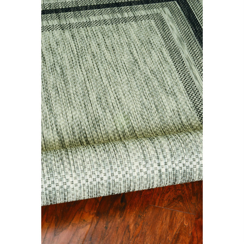 Tapis gris touffeté à motif géométrique