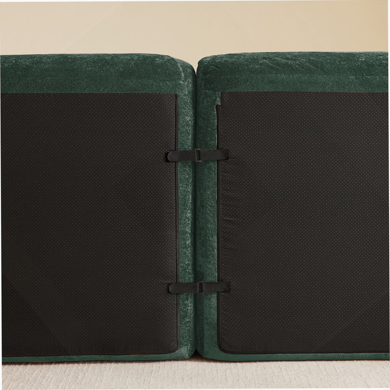 Canapé en forme de U sans os avec revêtement en velours capitonné, support ergonomique et repose-pieds amovibles pour des sièges flexibles.