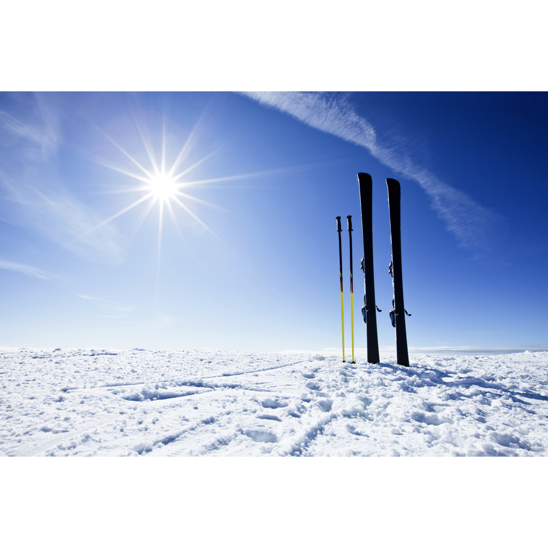 Skis On Top Of Slope Against Sun von Mbbirdy - No Frame Set on Canvas