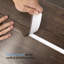 Bande de vinyle auto-adhésive de 0,14 po d'épaisseur x 1,57 po de largeur x 120 po de longueur pour joindre les trous de plancher, les seuils de tapis-87097472