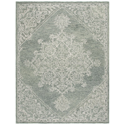Niti Hand Tufted Wool/Cotton Floral Rug in Green/Ivory