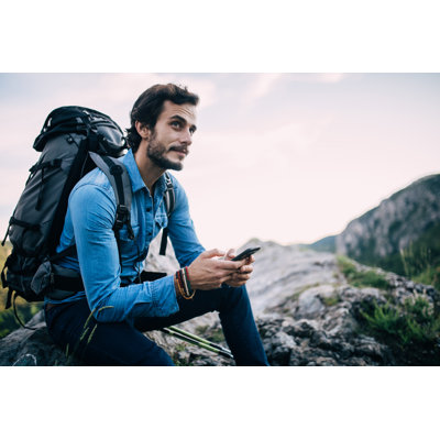 Hiker Using Mobile by South_agency - No Frame Art Prints on Canvas