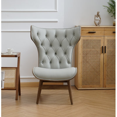 Fauteuil à oreilles capitonné Jeyshan