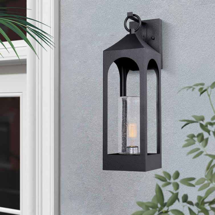 Marla Dusk to Dawn Iron Wall Light with Seed Glass Shade