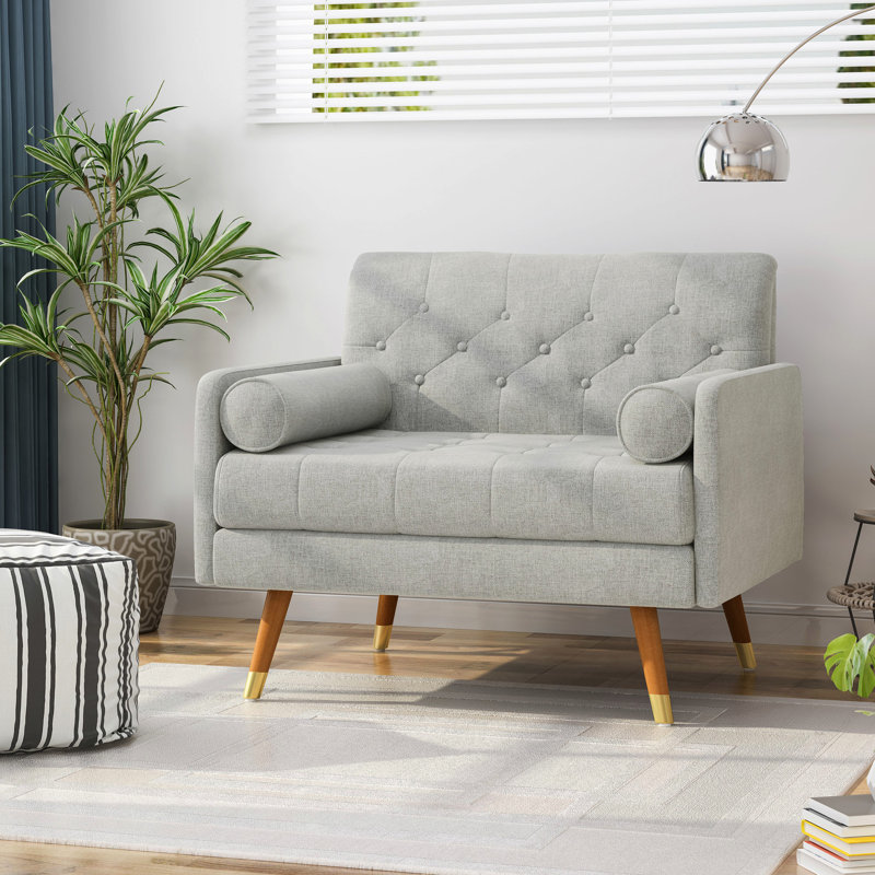 Fauteuil club gris avec pieds fuselés et capitonnage à boutons, Gris clair