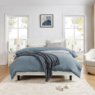 Amati Upholstered Wingback Platform Bed