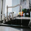 Whitehaus Collection Lead-Free Solid Stainless Steel Bridge Faucet with a Long Traditional Spout, Lever Handles and Side Spray