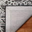 Tapis floral noir / ivoire en coton et coton touffeté à la main Chrishaunda-1071194486