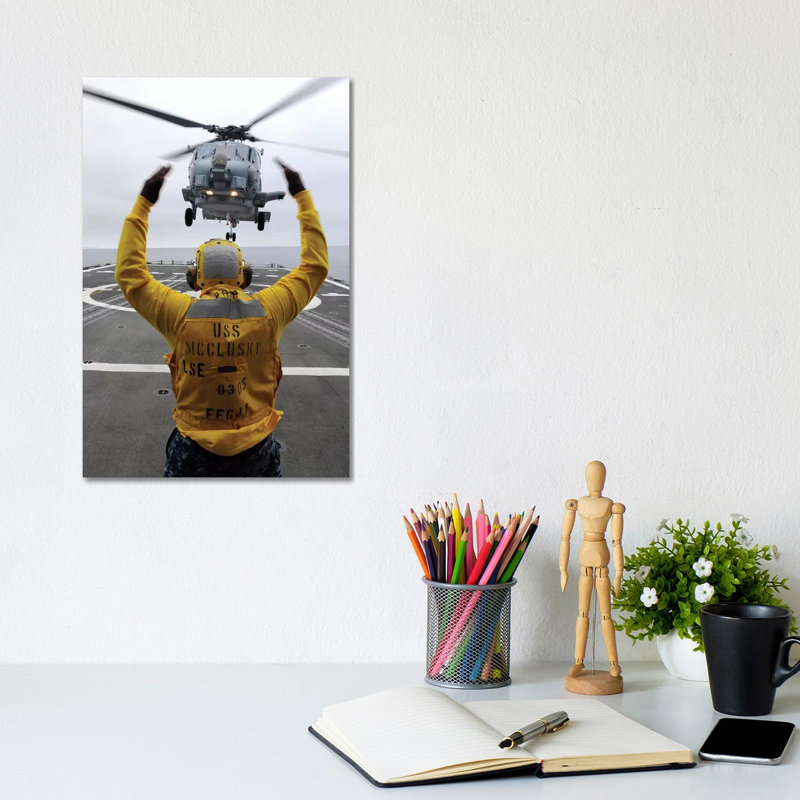 Petty Officer Guides an SH-60R Sea Hawk Helicopter onto the Flight Deck of USS McClusky 1 Piece Wrapped Canvas Wall Art