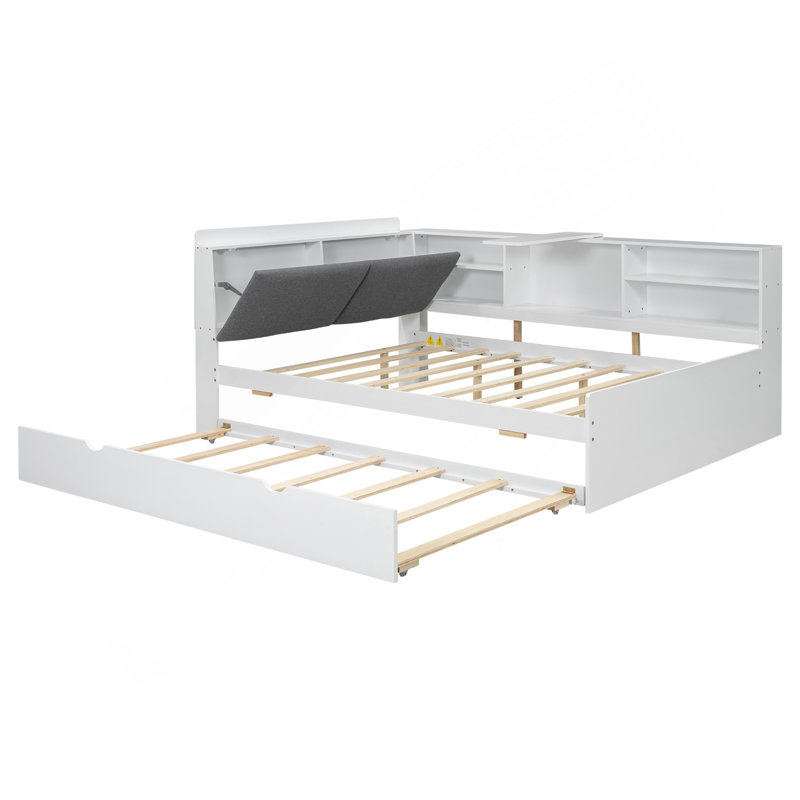 Lit plateforme en bois avec lit gigogne, tablettes et tête de lit en bois