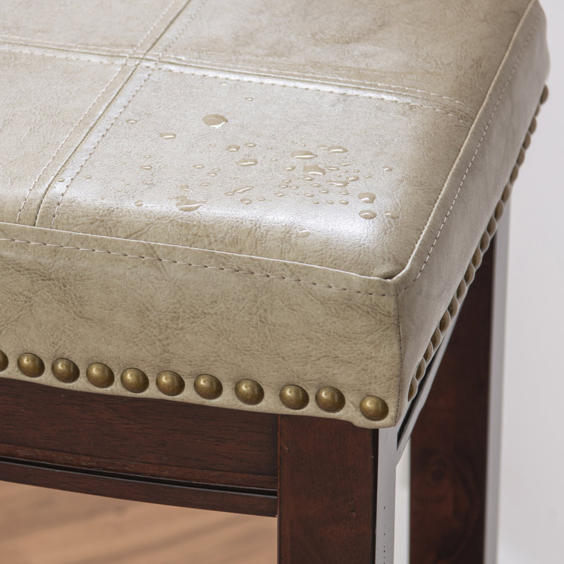 Tabouret de comptoir et de bar en bois massif sans dossier avec siège rembourré Bartonville, Beige simili cuir / Brun foncé