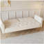 Luxueux canapé-lit en velours beige avec garniture cloutée et coussin décoratif assorti pour une vie élégante