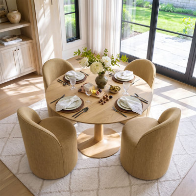Ensemble table et chaises de salle à manger pour 4 personnes avec table ronde et 4 chaises pivotantes en tissu rembourré.