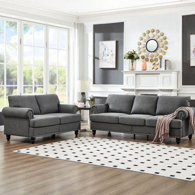 Canapé en tissu moderne à 5 places pour le salon, tissu d'ameublement gris, rond avec clous, structure en bois massif, coussins amovibles, espace de rangement sous les sièges