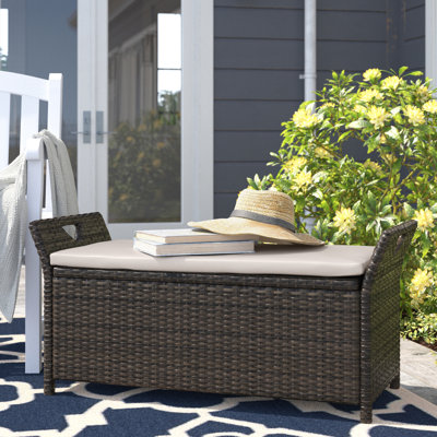 Outsunny 29 Gallon Patio Wicker Storage Bench, Outdoor PE Rattan Patio Furniture, 2-In-1 Footstool Rectangle Basket Box w/ Handles & Cushion, Cream