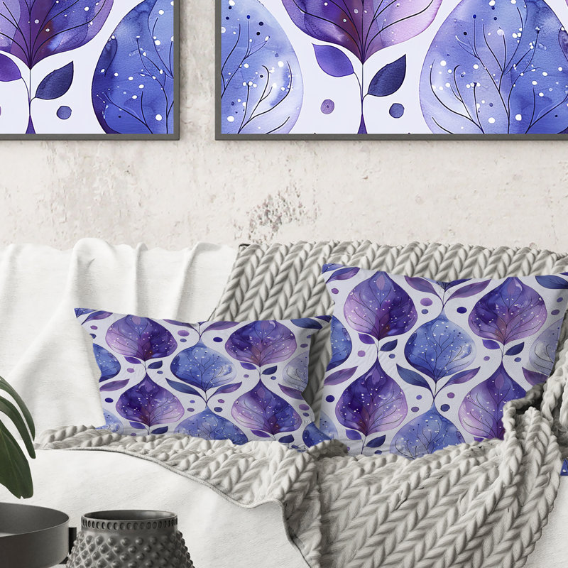 Coussin lombaire mauve à motif floral blanc et mauve