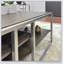 Élégante table basse en bois à structure métallique avec tablette Padena